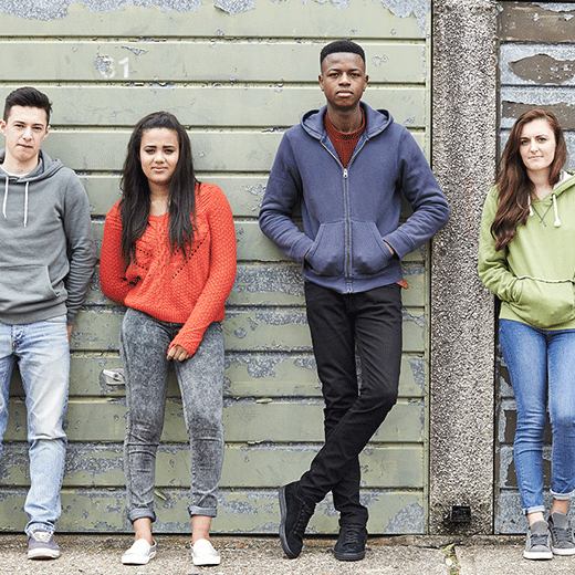 Young people in front of wall 520x520