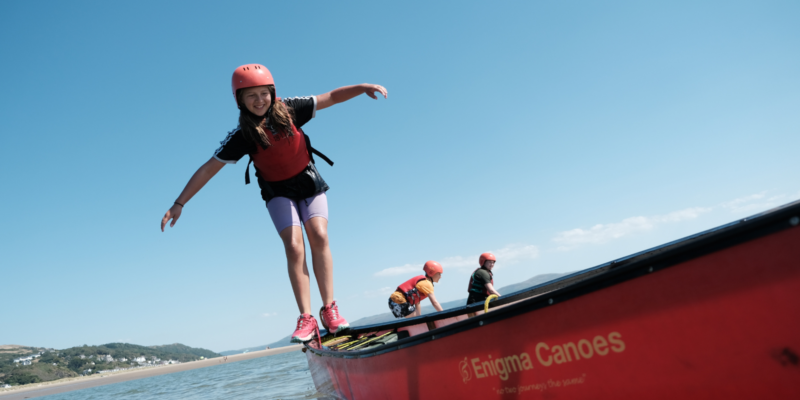 Girl balancing on canoe Aberdovey banner